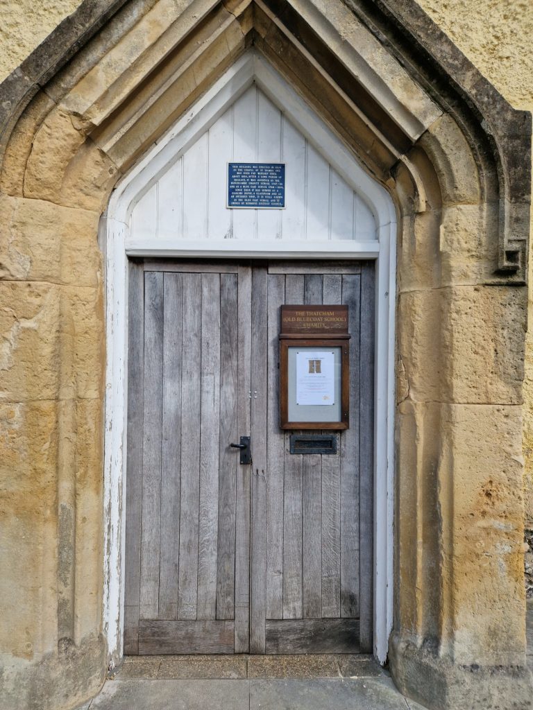 An image of the existing OBS Oak doors which need to be repaired