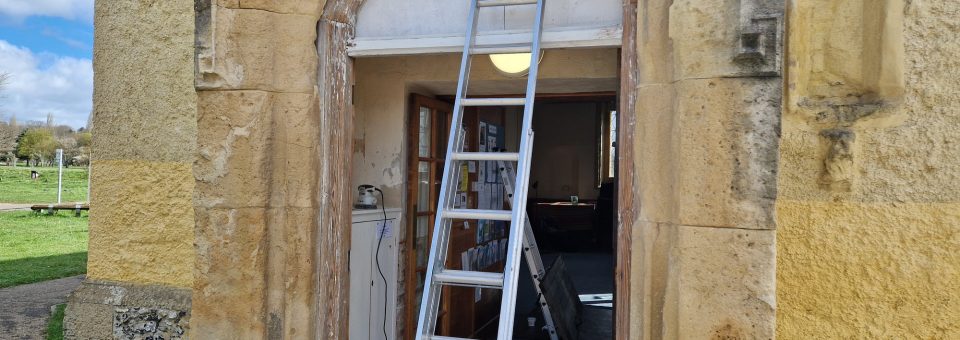 Picture of OBS entrance with paint removed from door frame